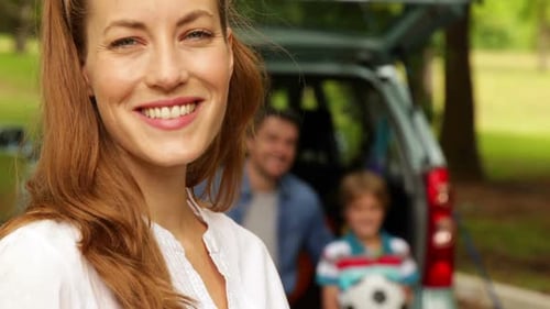 Happy Family Portrait in Park on Sunny Day