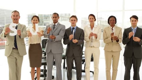Happy Business People Holding Letters Spelling Success