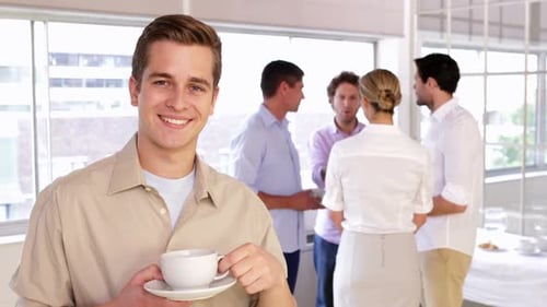 Young Adults Having a Discussion During Coffee Break