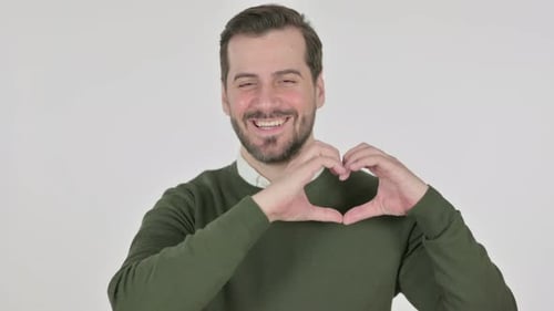 Man Smiling Making Heart Shape with Hands