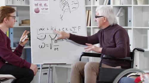 Professor in Wheelchair Teaches Students Math Equations