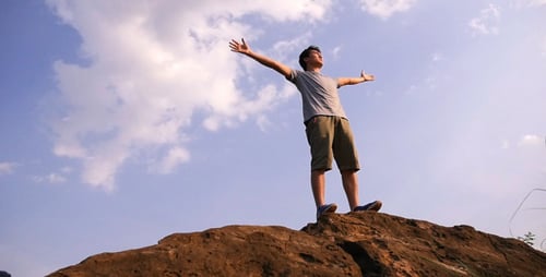 Man On Peak Of Mountain