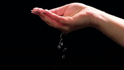 Water Dripping from Hand with Pink Nails