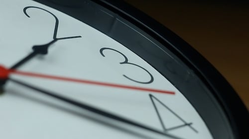 Clock Hands Moving Quickly to Represent Passing Time