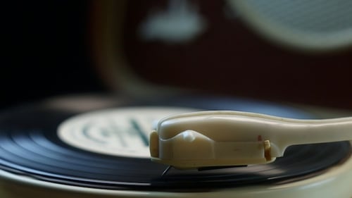 Record Player Needle on a Spinning Vinyl Disc