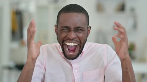 Young Adult Man Expressing Joy and Anger