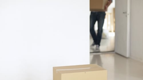 Man Moving Big Cardboard Boxes