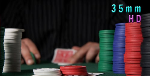 Man Playing Poker with Chips on Table