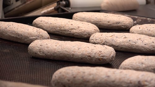 Placing Raw Bread Dough on a Baking Sheet