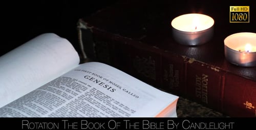 Open Bible Illuminated by Soft Candlelight