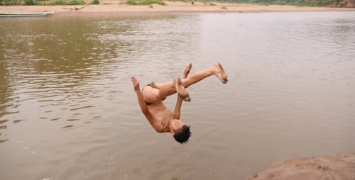 Asian Boy Front Flip Into River