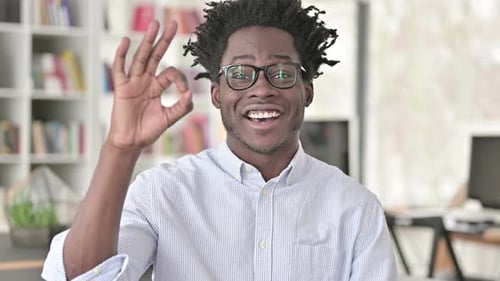 Young Man Gives Ok Hand Gesture