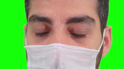 Close Up of Man Wearing Face Mask with Green Screen