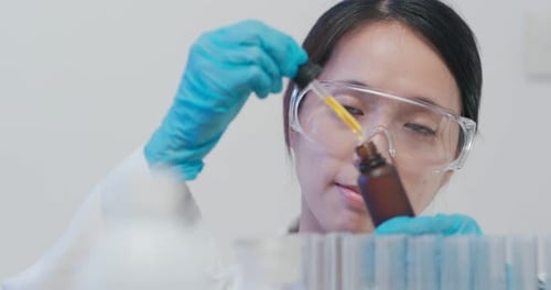 Scientist doing experiment in laboratory