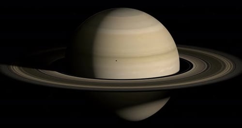 Rotating Saturn Planet with Rings in Dark Space Background
