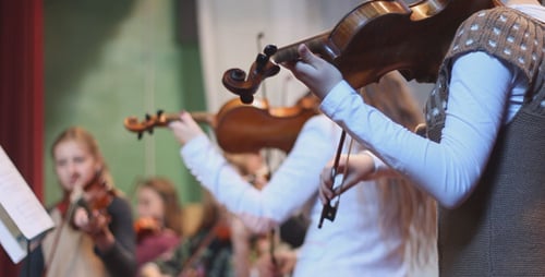 Violin Students Performing in Music Program