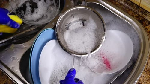 A Woman Washes Dishes 21