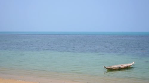 Beautiful Beach And Tropical Sea With Small Boat
