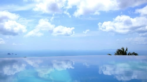 Blue Endless Swimming Pool With Blue Sky And
