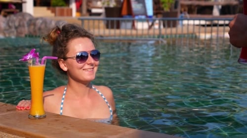 Couple Sipping Drinks at Luxury Tropical Resort