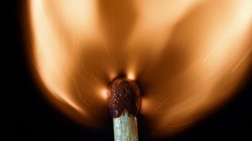 Match Ignites and Burns with Bright Flame