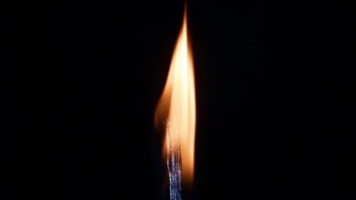 Realistic Match Flame Burning Out on Black Background