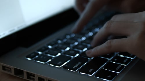 Hands Working On Laptop