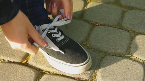 Girl Tying Shoelaces