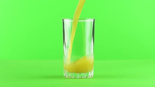 Juice Pouring Into Glass Isolated on Light Green Background