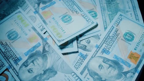 American 100 Dollar Banknotes are Rotating on the Table Close Up