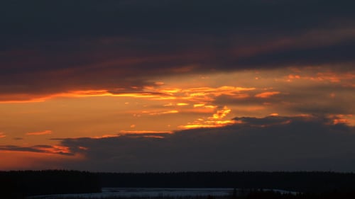 Clouds Moving Across the Sky at Sunset
