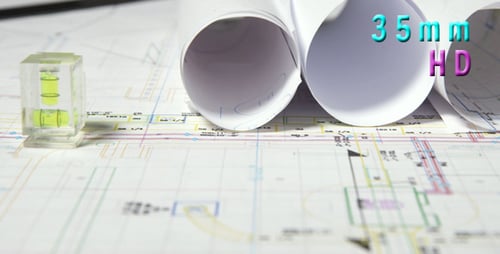 Architectural Blueprints with Rolled Plans and Bubble Level