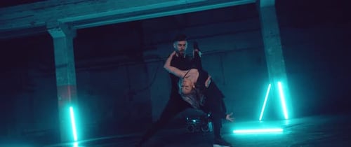 Male and Female Dancing Together at Night