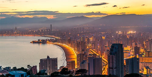 Above Modern Beach City at Dusk