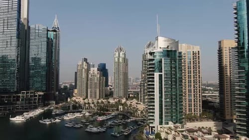 Dubai Docks with Lots of Luxury Yachts Surrounded By the Massive Skyscrapers
