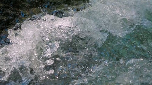 Flowing Water Of Stream Splashing.