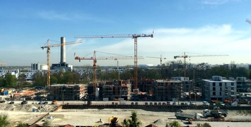 Construction Site with Towering Cranes in the Daytime