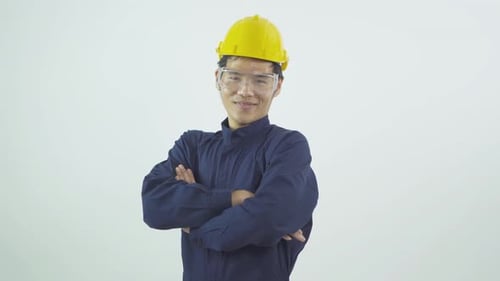 Smiling Construction Worker with Safety Gear and Hard Hat
