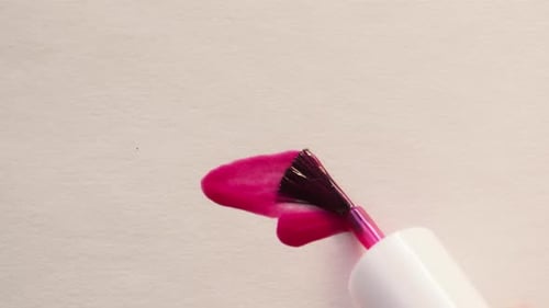 Pink Nail Polish Applied with Brush Close Up