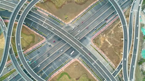 Top View To the Cars Driving on Multi-level Highway on the Sunset. Highway Multilevel Junction Road