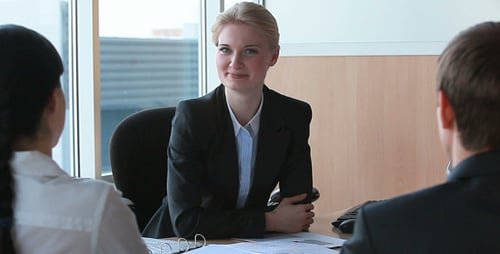 Business Meeting with Professionals in Modern Office