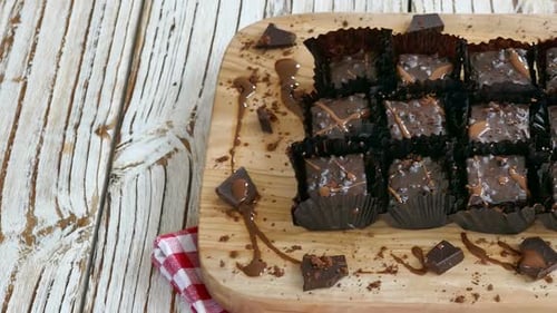 Chocolate Brownies Displayed on Wooden Board
