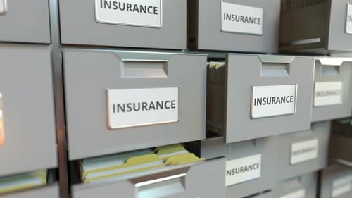 INSURANCE Text on the Drawers of a File Cabinet
