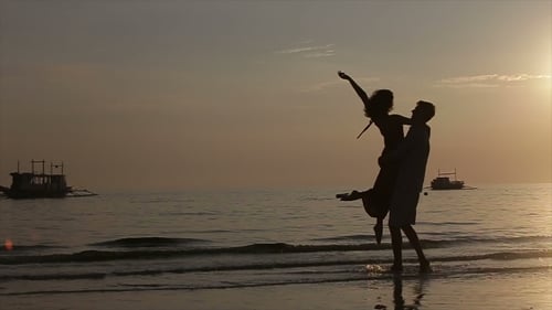 Romantic Couple Embracing on Beach at Sunset