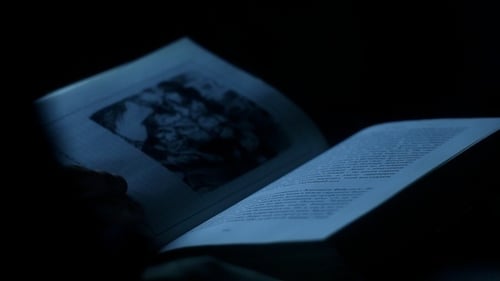 Close-Up of Book Pages Being Turned at Night