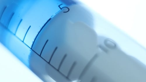 Drawing Liquid in a Syringe Close Up