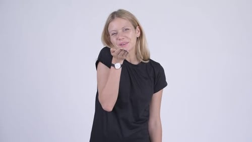 Blonde Woman Blowing Kisses With a Smile