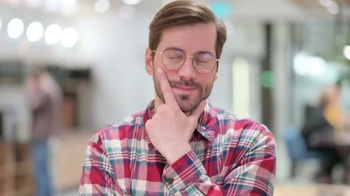 Pensive Male Designer Thinking About Something