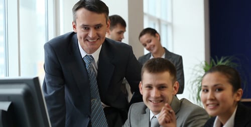 Businessman talking to co-workers
