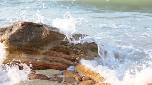 Waves Crashing on Rocks by the Ocean Shore